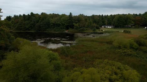 early fall gloom covering the still waters of little black lake