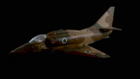 a jet playtoy with a black background in 4k