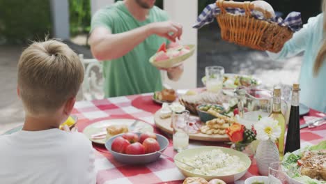 happy family eating together at table