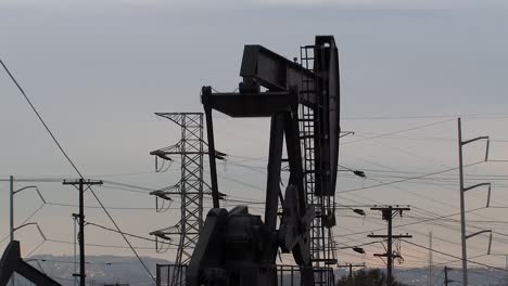 oil field with oil pumps in los angeles in the evening, california, usa-1