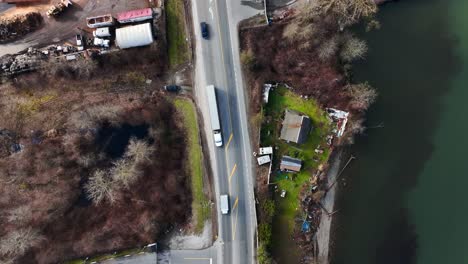 Flying-Above-River-Road-Near-Vito's-Dock-On-Banks-Of-Fraser-River-In-Delta,-British-Columbia,-Canada