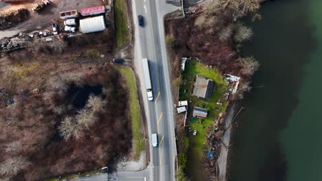 flying above river road near vito's dock on banks of fraser river in delta, british columbia, canada