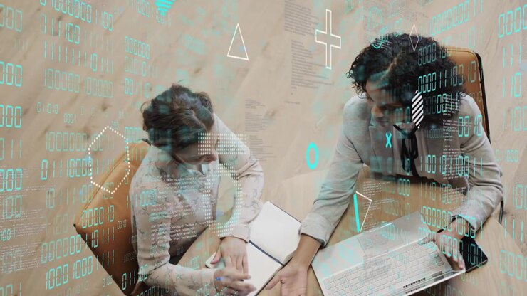 Woman opening notebook and man typing laptop, initiating tech review with teal overlay over devices