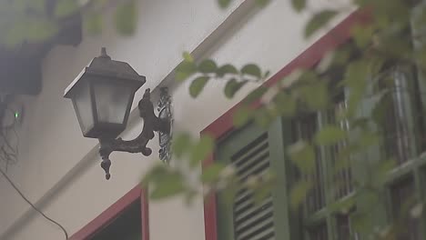 a village house with an old chandelier being lit on the afternoon