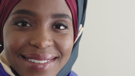 close up portrait beautiful black muslim woman smiling happy enjoying success pretty african american female wearing hijab headscarf on white background