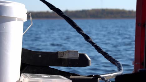 a man rides a boat using an electric motor