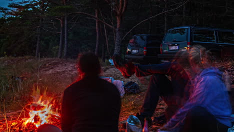 friends camping in the forest at night