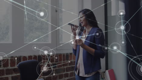 Animation of network of connections over woman in office