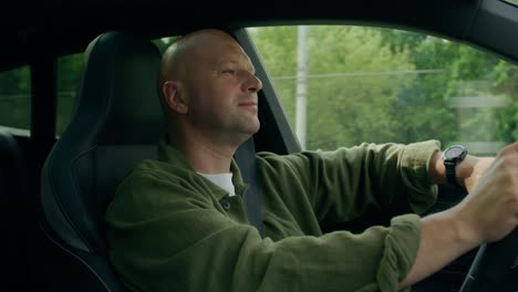 man driving a car