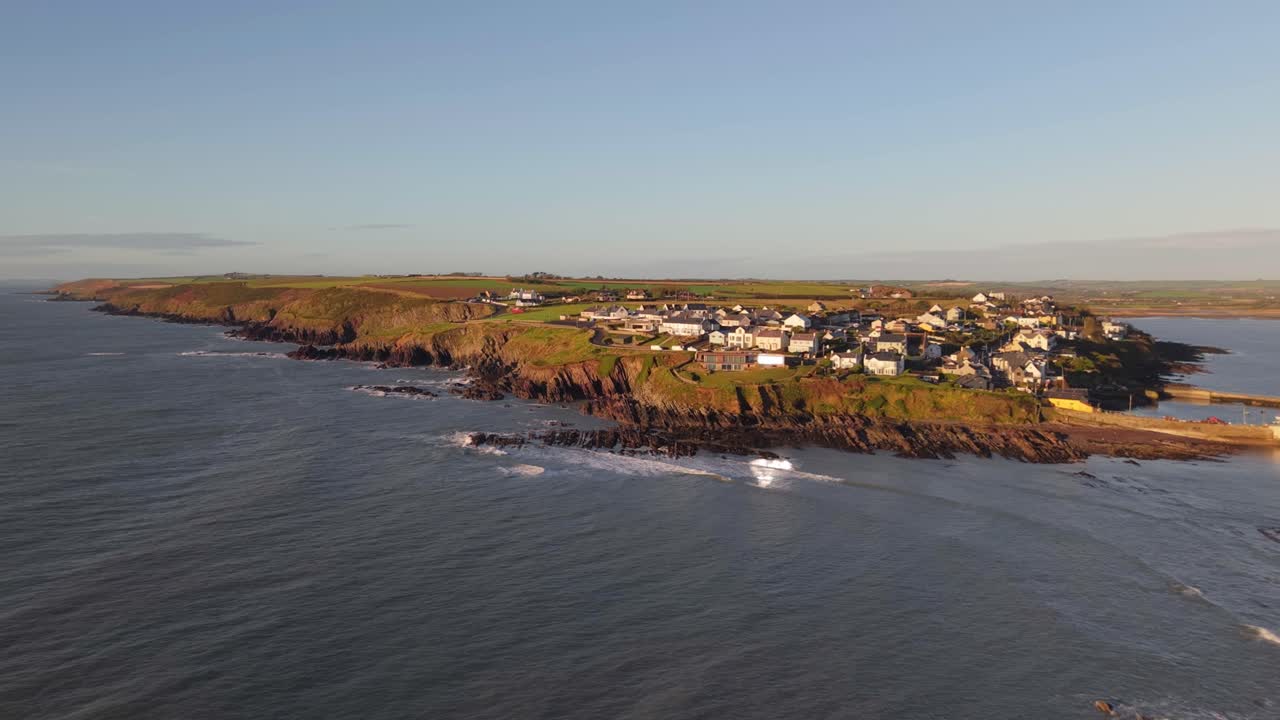 Flying Towards The Ballycotton Coastal Village in County Cork, Ireland. - aerial shot