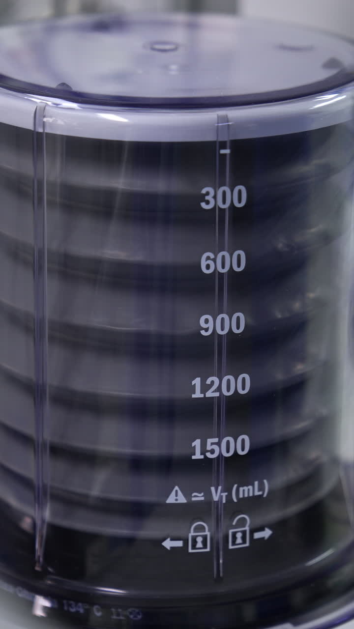 Falling and rising pump of an artificial lung ventilation machine. Equipment pumping air for the patient in surgery room. Vertical video