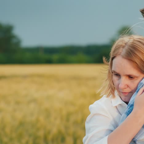 A-Woman-Snuggles-Up-To-A-Man's-Shoulder-On-A-Windy-Day-2