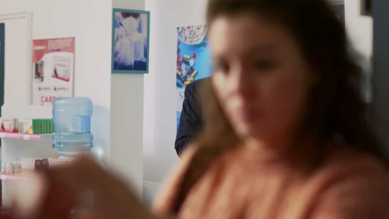 Customer interacting with pharmacist in a pharmacy