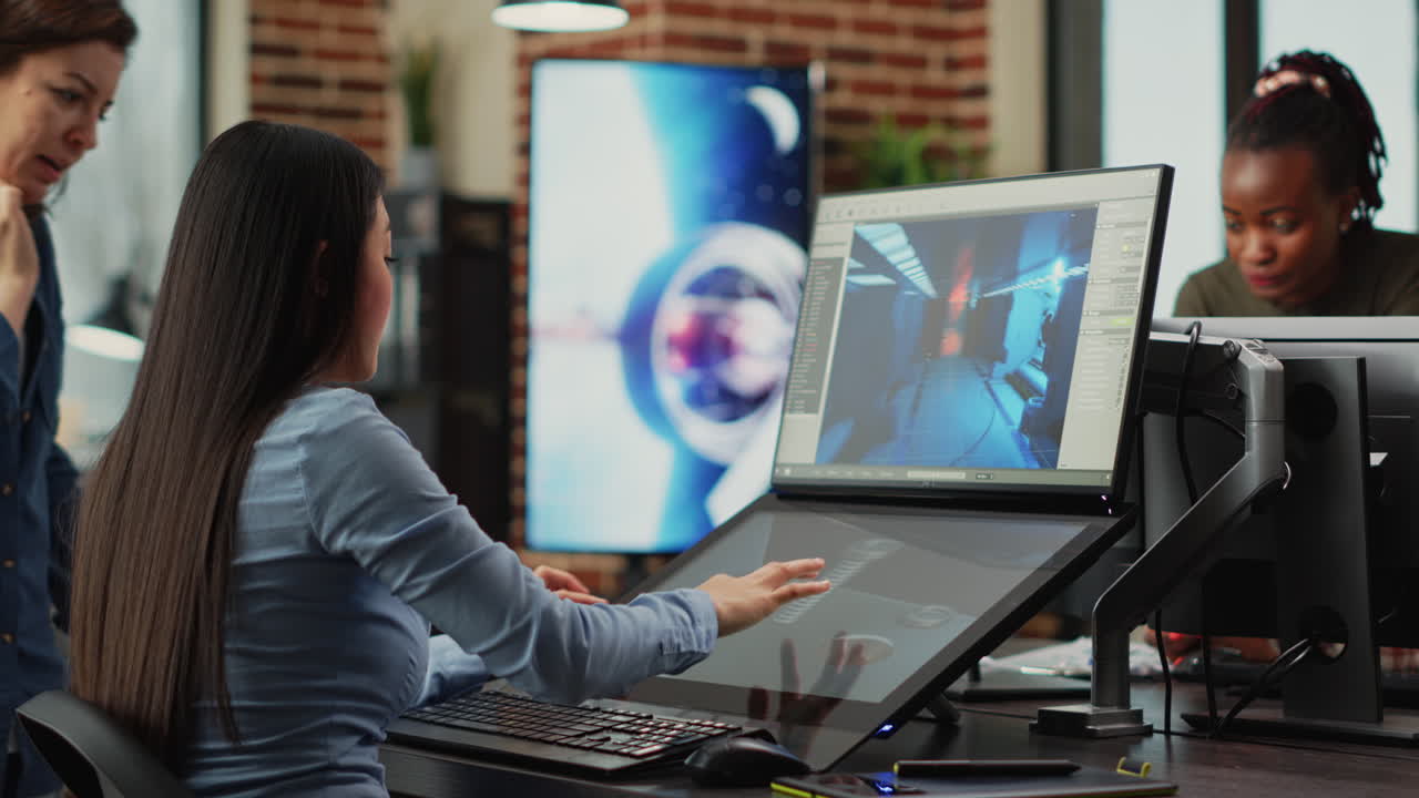 Team of people working with touchscreen display for gaming app