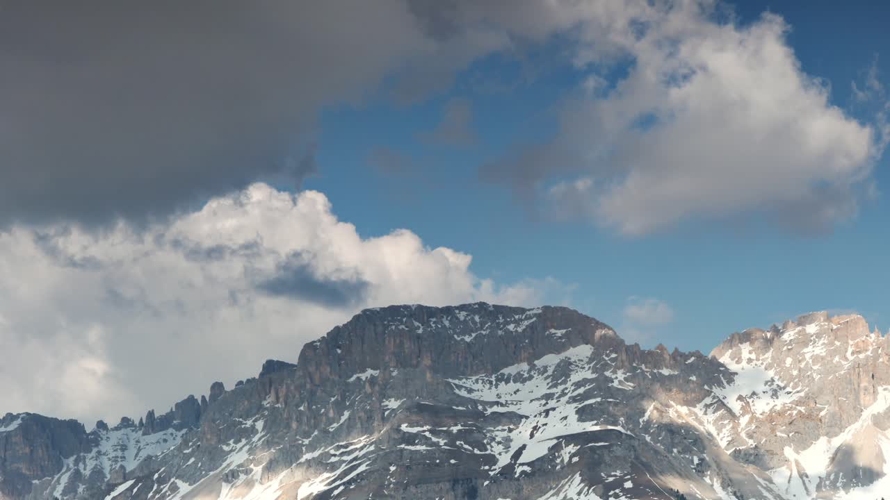 Clouds rolling over the Mountains - location: Dolomites, South Tyrol, Italy, 4k time-lapse footage