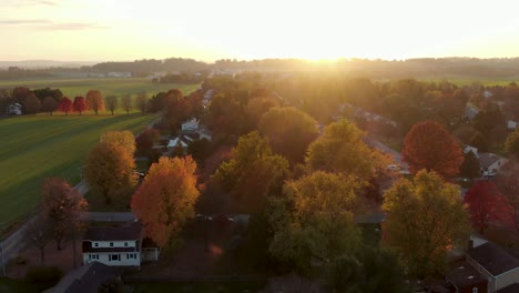 Aerial-truck-shot-at-sunrise,-sunset-during-autumn