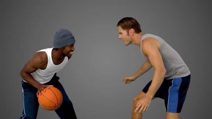 Men playing at basketball