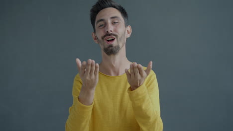 man making gestures and kissing gesture