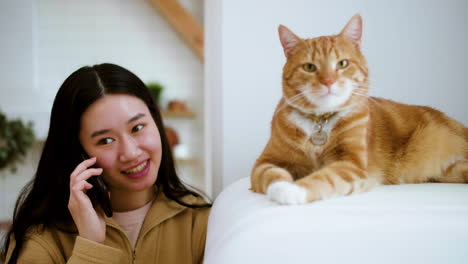 woman feeding cat