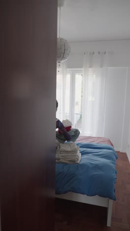 bedroom scene and woman in sleeveless outfit