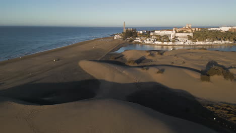 morning wonders over maspalomas: aerial view of gran canaria's dunes and lighthouse