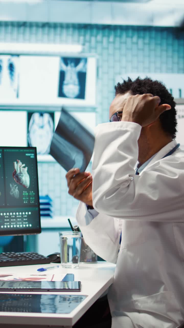 African american physician presenting the x ray diagnostics results to a patient