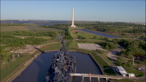 an aerial over a battleship and monument in texas