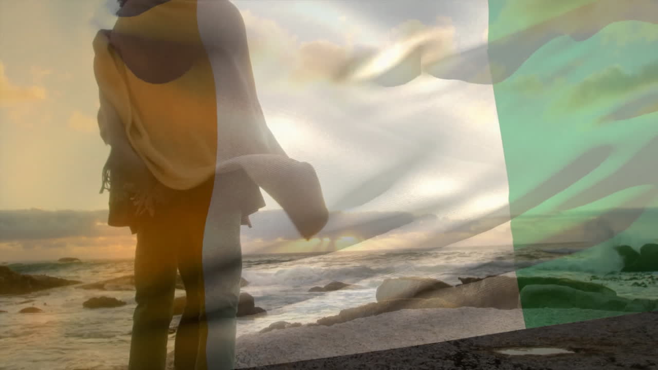 해변에서 포옹하는 아프리카계 미국인 부부 위의 코트디부아리 발의 애니메이션