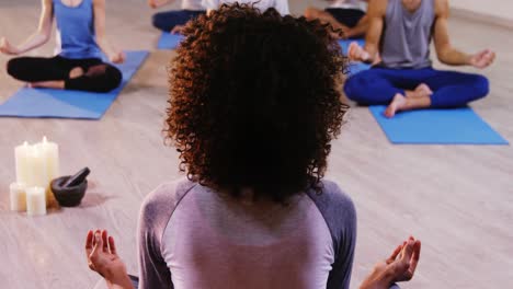 instructor taking yoga class