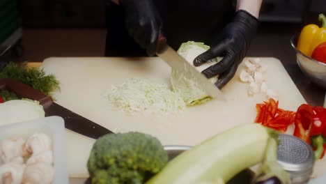 chef chopping cabbage