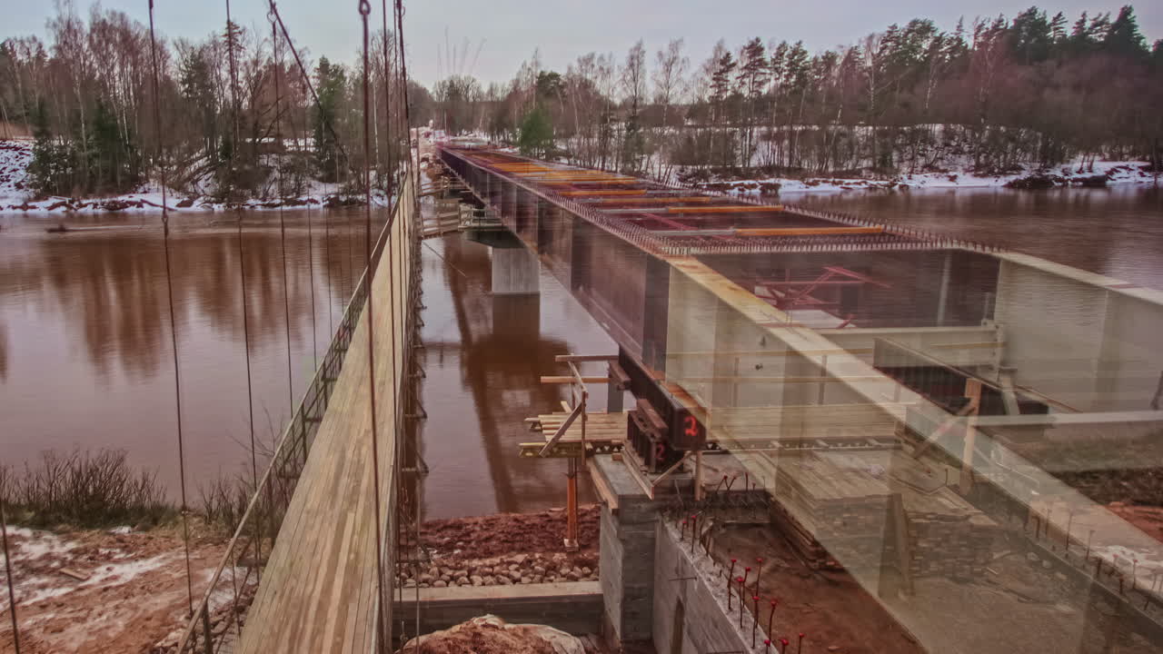 Time lapse of an old bridge being replaced by a newly constructed bridge