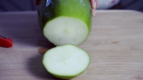 Cutting-the-tip-off-the-Green-and-ripe-yellow-organic-fresh-papaya-pawpaw