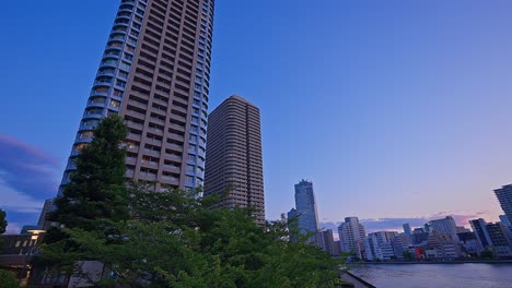 Evening-Tokyo,-Tsukuda,-Toyosu-skyscrapers-and-bridge-the-Sumida-River