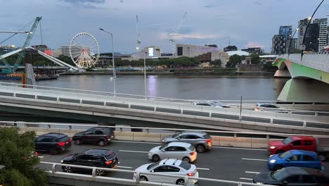 timelapse dusk shot capturing brisbane city pacific motorway traffics at rush hour after work, overlooking at south brisbane parklands across the river, queensland, australia