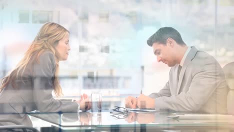 animation of businessman and businesswoman talking in office over cityscape