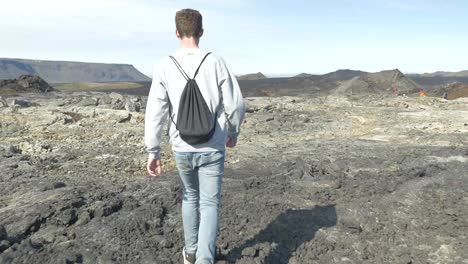 person walking in vulcano landscape in iceland-1