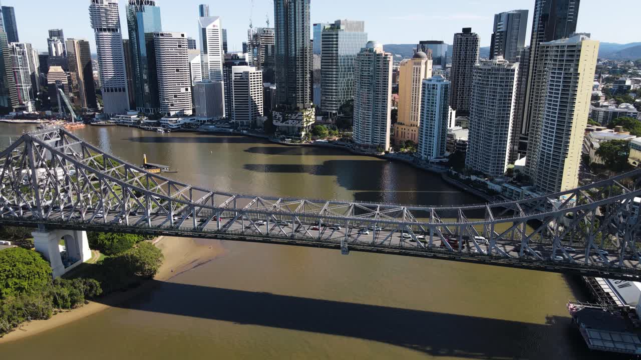 Urban city views of a fire truck traveling along the heritage-listed Story Bridge a steel cantilever bridge spanning the Brisbane River. Aerial view