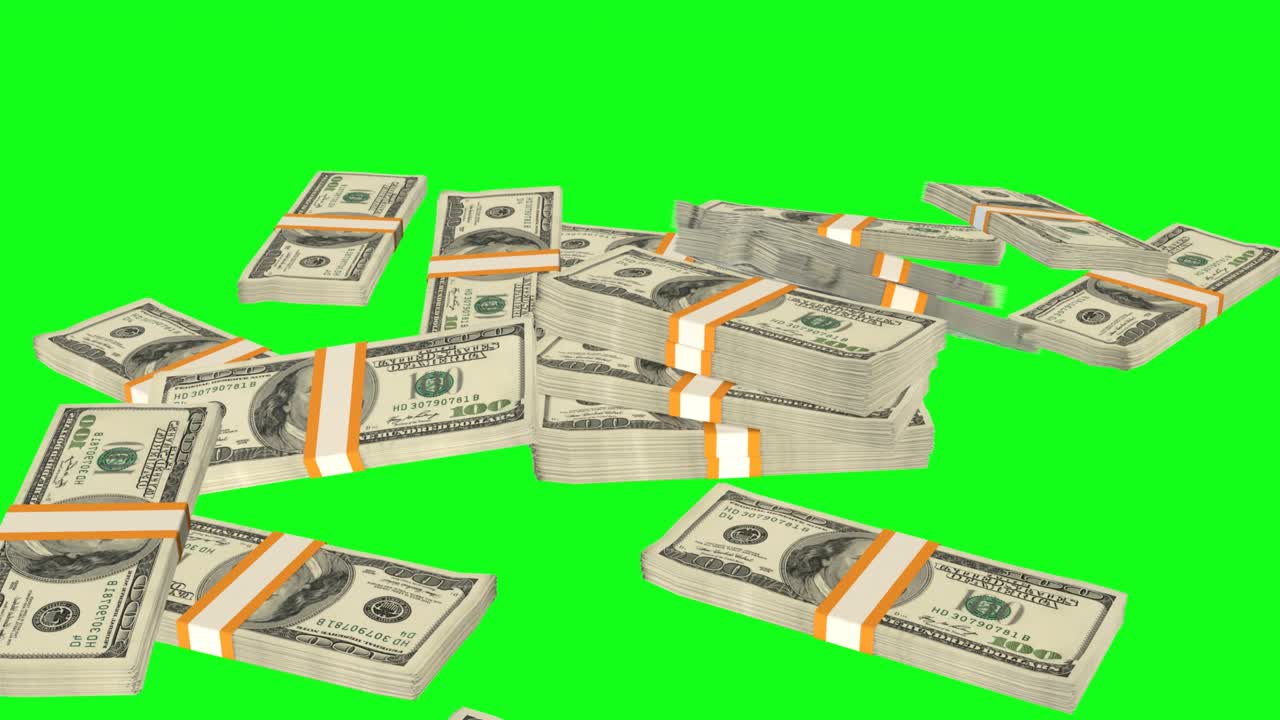 Many wads of money falling on table on chromakey background. 100 US dollar banknotes.