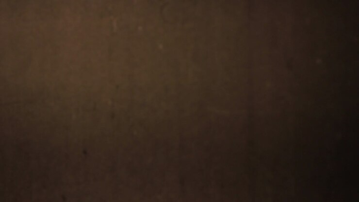 Dark Brown Textured Background with Vintage Film Grain