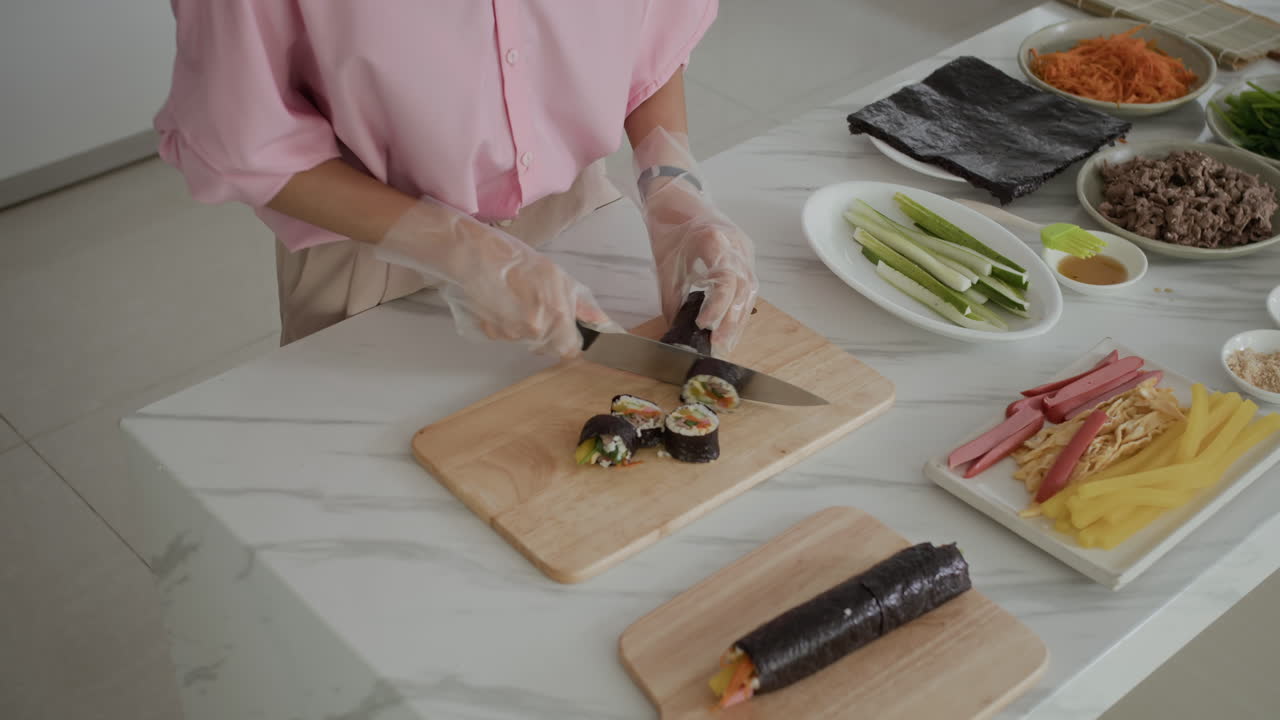 Anonymous Housewife Cutting Gimbap for Dinner