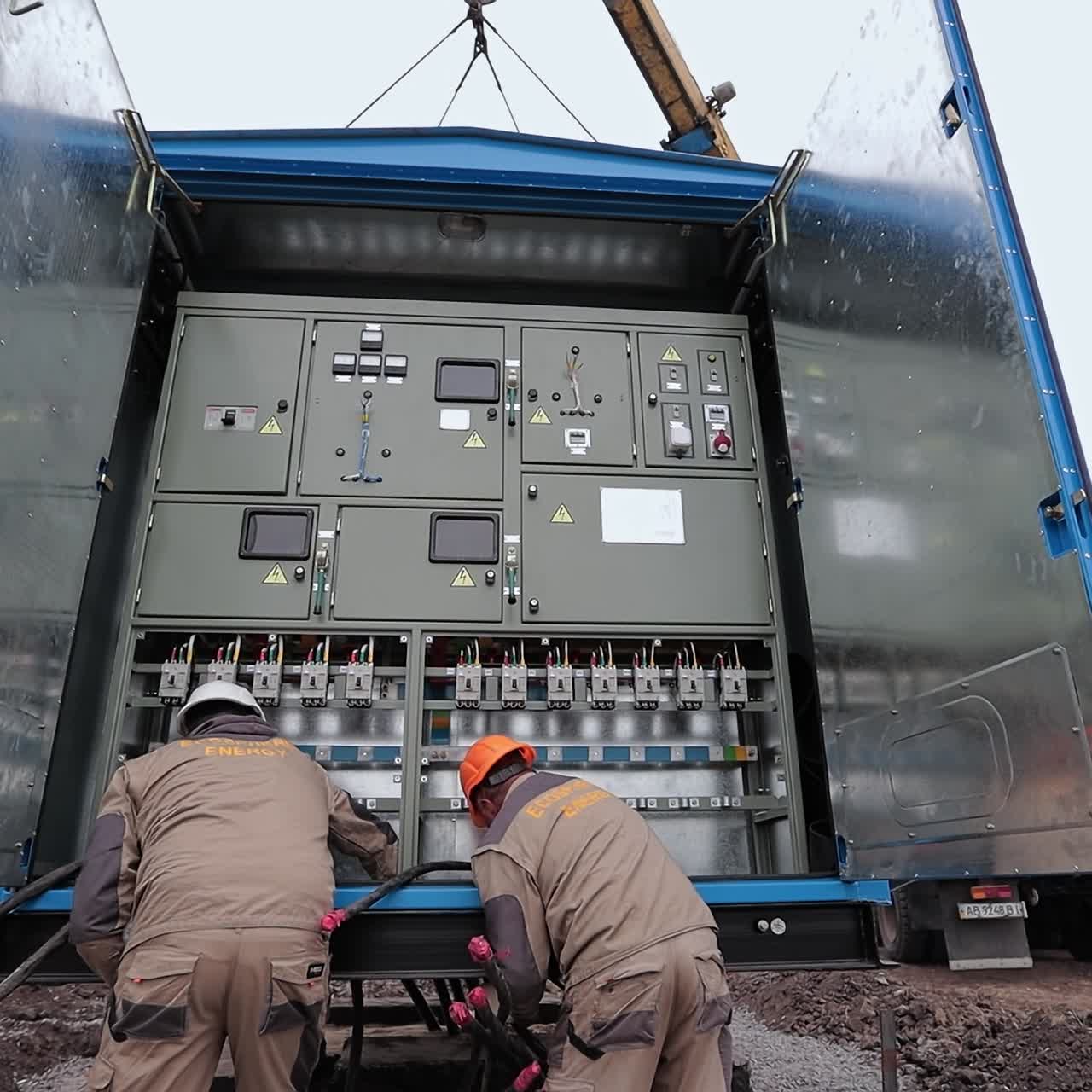 Electric supply station engineer instalation. Specialists checking electic station