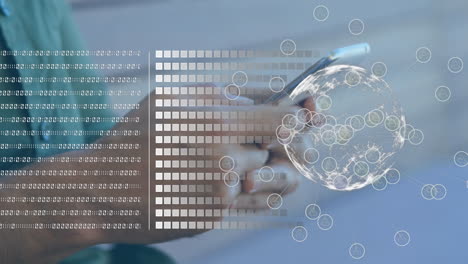 Animation of binary coding data processing and globe over biracial man using smartphone