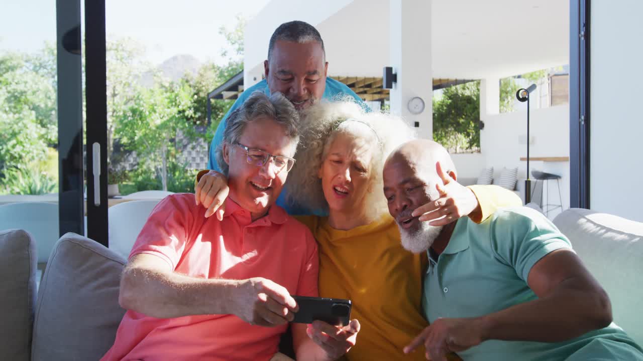 Happy senior diverse people taking selfie at retirement home