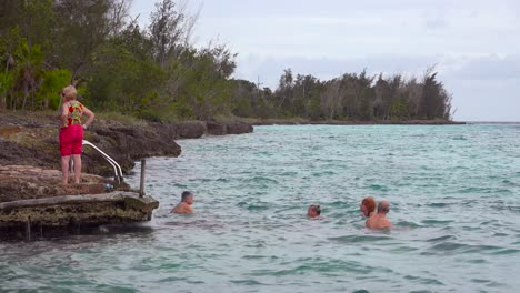 tourists swim in the bay of pigs cuba