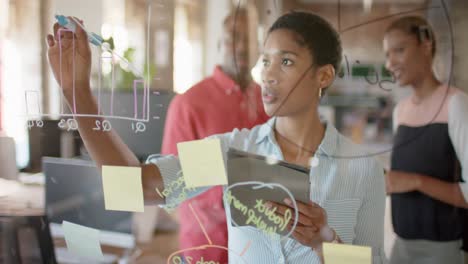 portrait of happy african american colleagues discussing work in office, slow motion