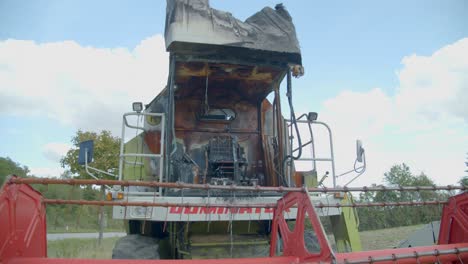 destroyed combine harvester in a farmland - close up