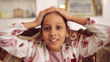 portrait of an indian child at home during coronavirus lockdown