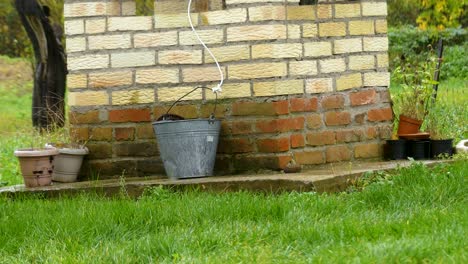 detail of water well with bucket, europe