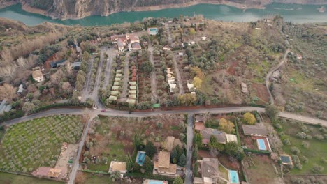 beautiful-high-rise-drone-footage-of-the-banks-at-the-Canales-Reservoir-in-Güéjar-Sierras-in-Spain