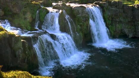 slow motion footage of kirkjufellsfoss near kirkjufell mountain on snaefellsnes peninsula, iceland